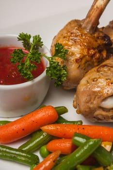 chicken legs with asparagus, lettuce and ketchup