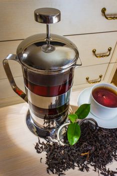 Tea and tea accessories on a background of antique furniture