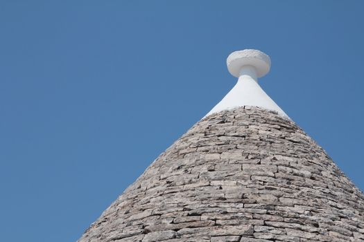 Roof of a trullo, a traditional apulian dry stone hut, typical a specific part of the south of Italy

