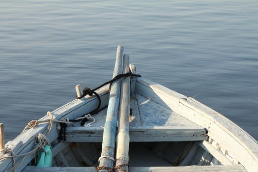 Bow of a fishing boat with paddles
