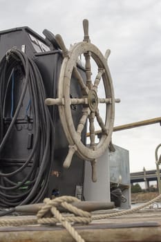 Antique Wooden Ship Steering Wheel on a Docked Old Historic Ship