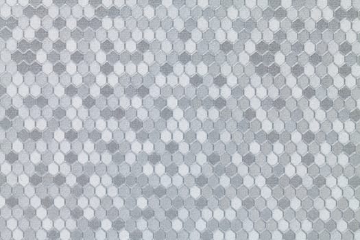 Abstract background of textured silver leather with a hexagon pattern