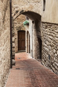 narrow street in a old tuscan village, italy