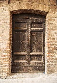 door of the old building in italian village of tuscany, italy