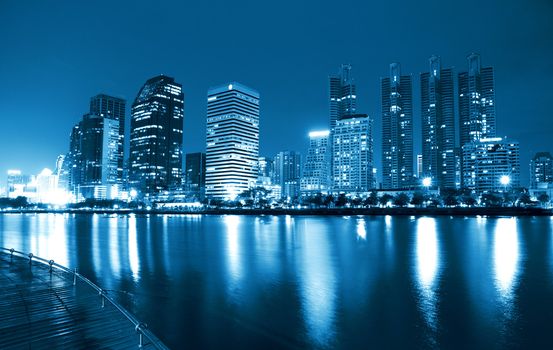 City at night, panoramic scene of downtown reflected in water,thailand