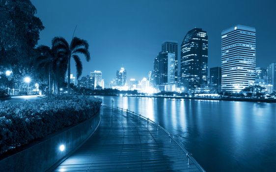 City at night, panoramic scene of downtown reflected in water,thailand