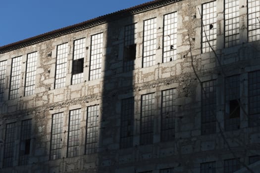 Granite facade of an old abandoned factory