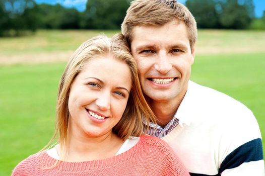 Profile shot of handsome loving couple embracing joy of life