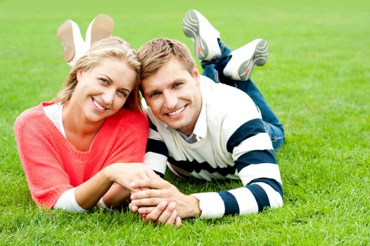 Happy attractive smiling young couple spending great day outside