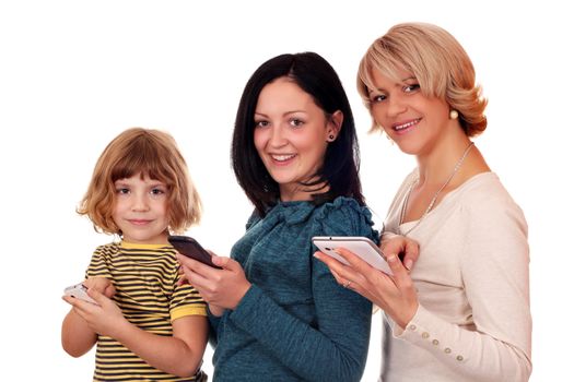 little girl  teenage girl and woman with phones and tablet pc