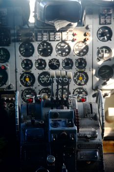 Cockpit of a very old airplane, focus on the throttle handles