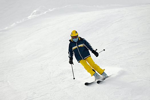 Female skier coming down the slope