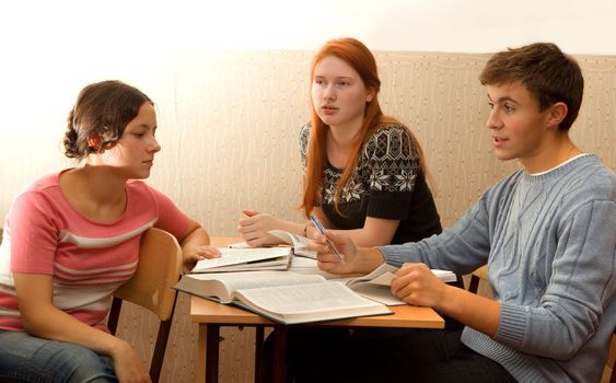 students discuss in class during recess. Bright sunlight