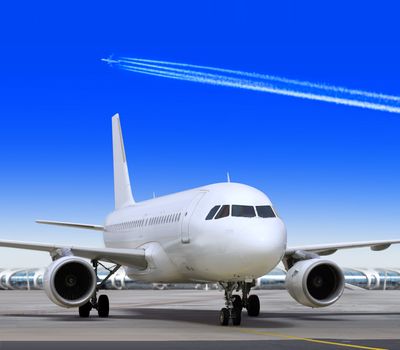 big passenger airplane is landing to runway of airport