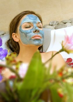 beautiful woman takes treatment in spa salon