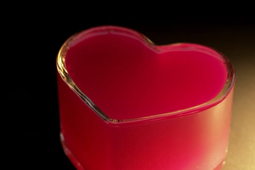 red heart made of glass. vertical image