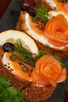Smoked salmon, capers, cheese and herbs