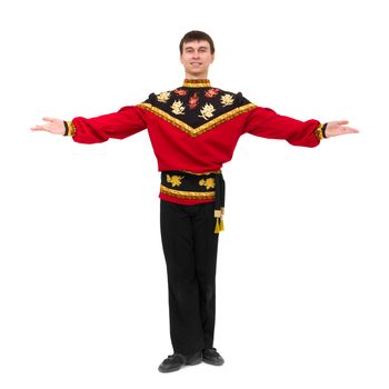 young man wearing a folk russian costume posing against isolated white background