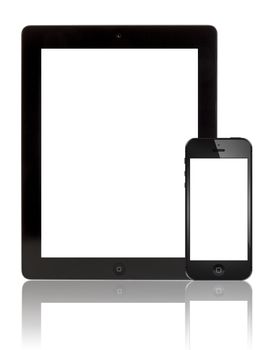 Galati, Romania- August 18, 2012: A black Apple iPhone 5 in front of a black Apple iPad 3 tablet. Both devices  with blank screen on white background. Studio shot.