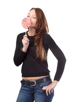 Studio shot of attractive smiling female with a lollipop isolated on white