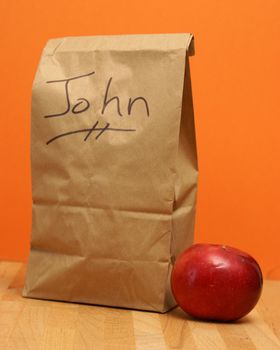 A brown lunch bags prepared specially for John.