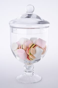 Candies. colorful candies in glass jar on the background