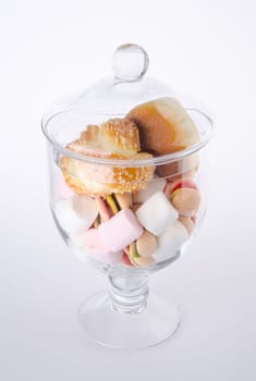 Candies. colorful candies in glass jar on the background