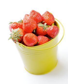 Perfect Raw Strawberries inside Yellow Bucket isolated on white background