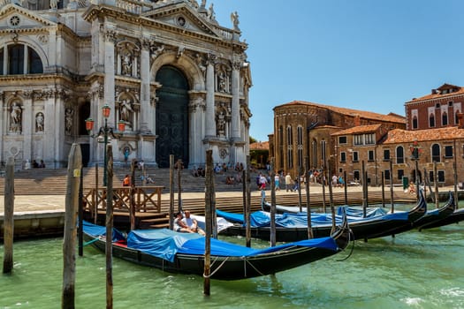 16. Jul 2012 - Gondolas and tourists at canal in Venice, Italy