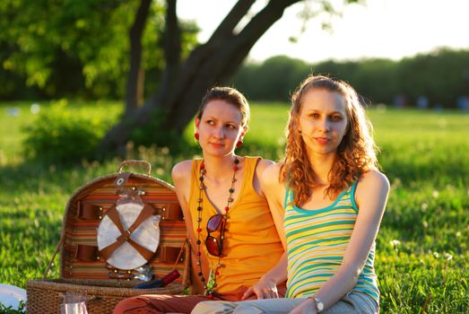 Girls on picnic at sunny day 