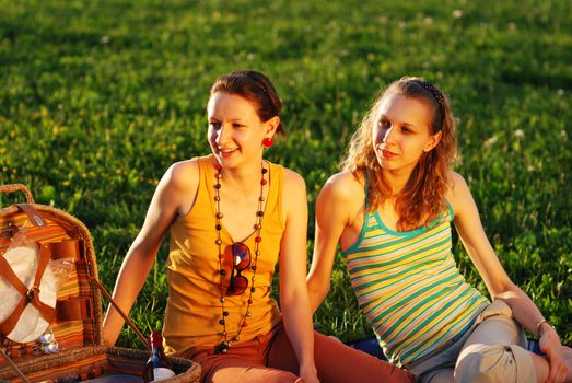 Girls on picnic at sunny day