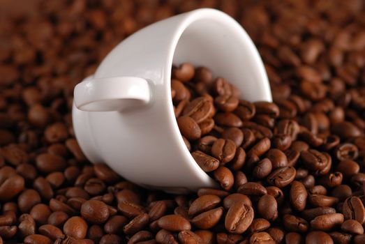 Coffee beans and white cup