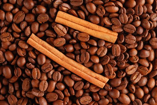 Coffee beans and cinnamon background