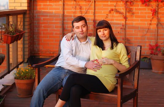 Young family waiting for a first child. Sunlight.