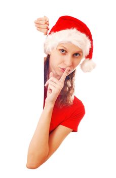 Girl in Santa's hat with a signboard, isolated on white