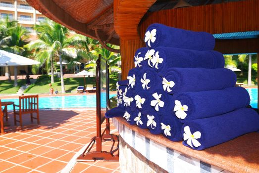 Blue towels near the swimming pool