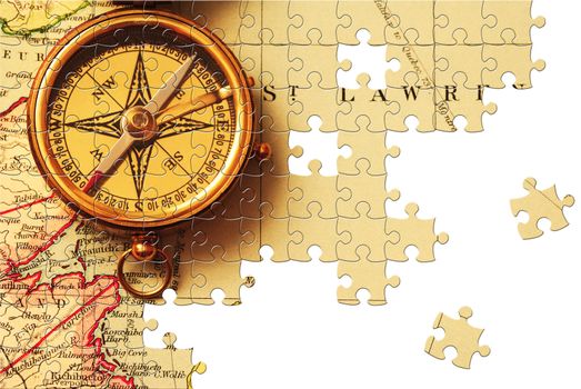 Puzzle Antique brass compass over old Canadian map background