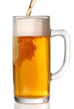 Beer mug isolated on white. Pouring beer in it.