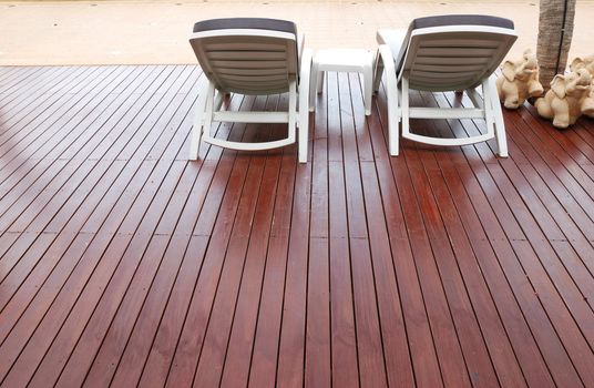 Patio with chaise lounges near luxury hotel