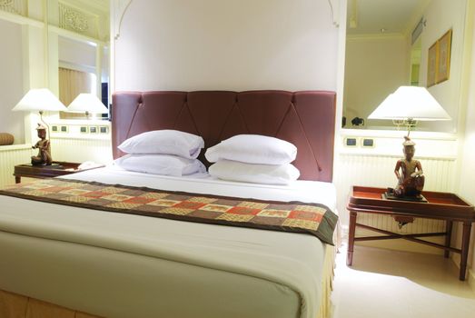Luxurious hotel room interior with king-size bed