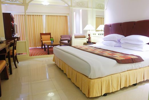 Luxurious hotel room interior with king-size bed
