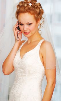 Bride talking over cell phone