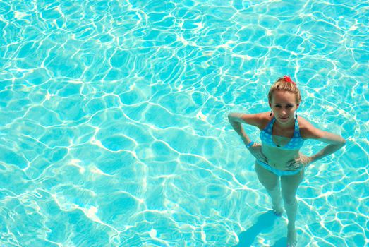 Girl in resort swimming pool