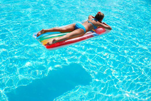 Girl in resort swimming pool