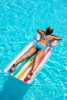 Girl in resort swimming pool