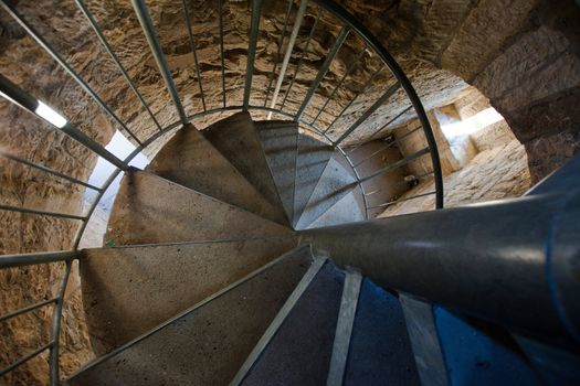 Medieval spiral staircase in a tower looking down