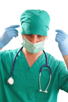 Doctor pulling on surgical mask