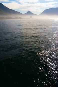 Haze-covered mountains off Hout Bay, South Africa