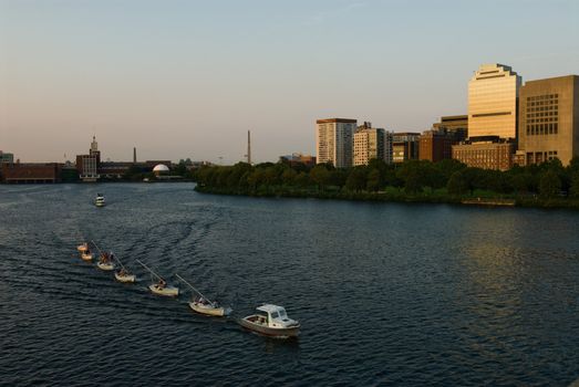 Novice sailors getting a tow on the Charles River