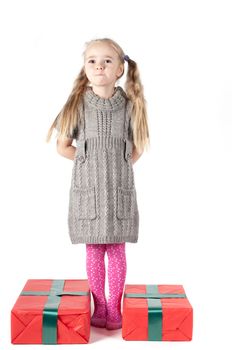 Beautiful girl with two christmas presents on white